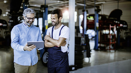 Aftermarket 2 men in a garage
