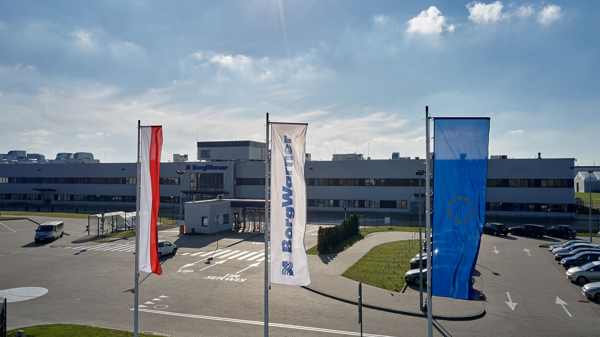 Facility picture with flags in front