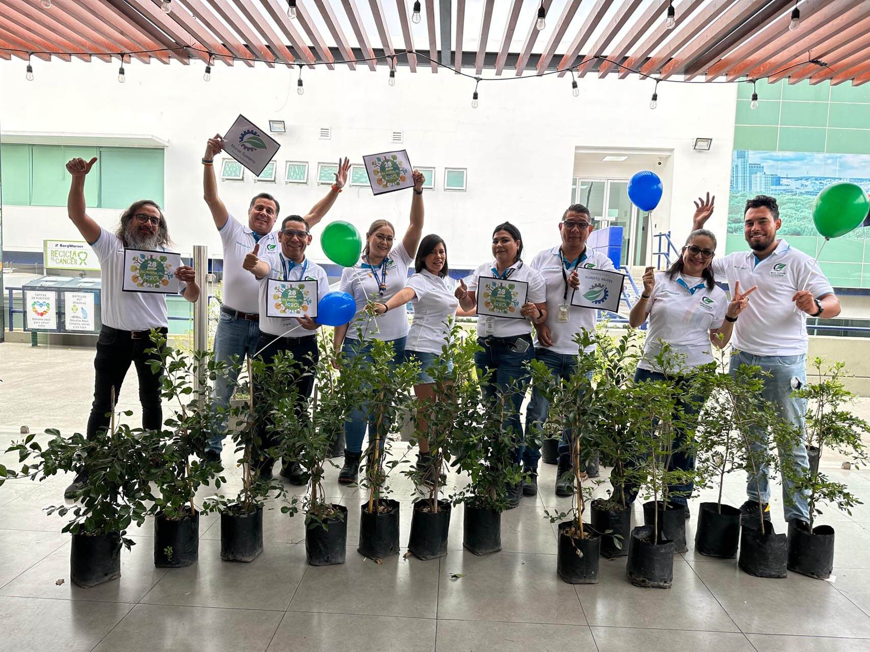 Happy group of participants celebrate with balloons