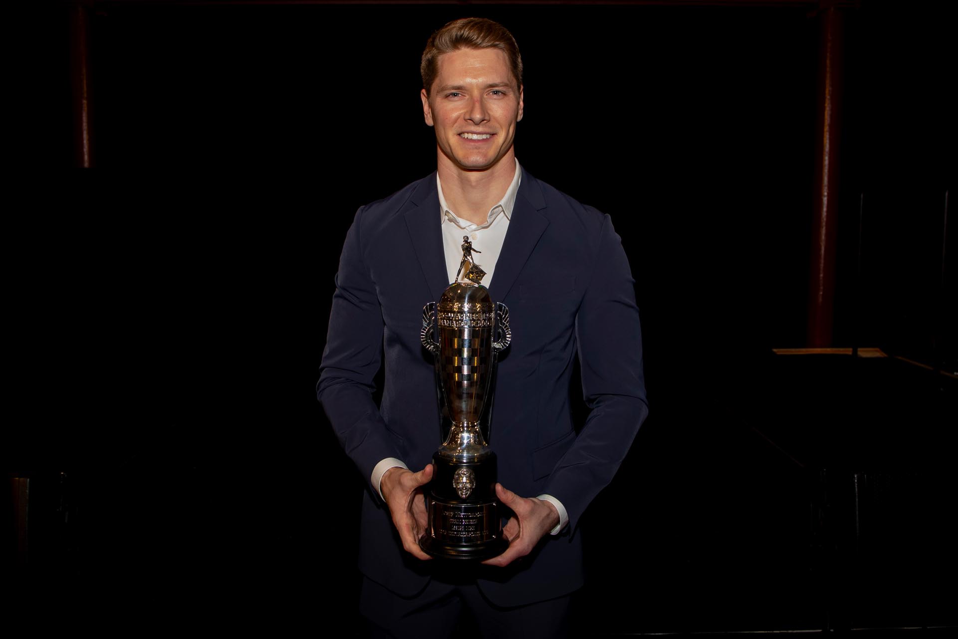 Josef Newgarden holding Baby Borg trophy