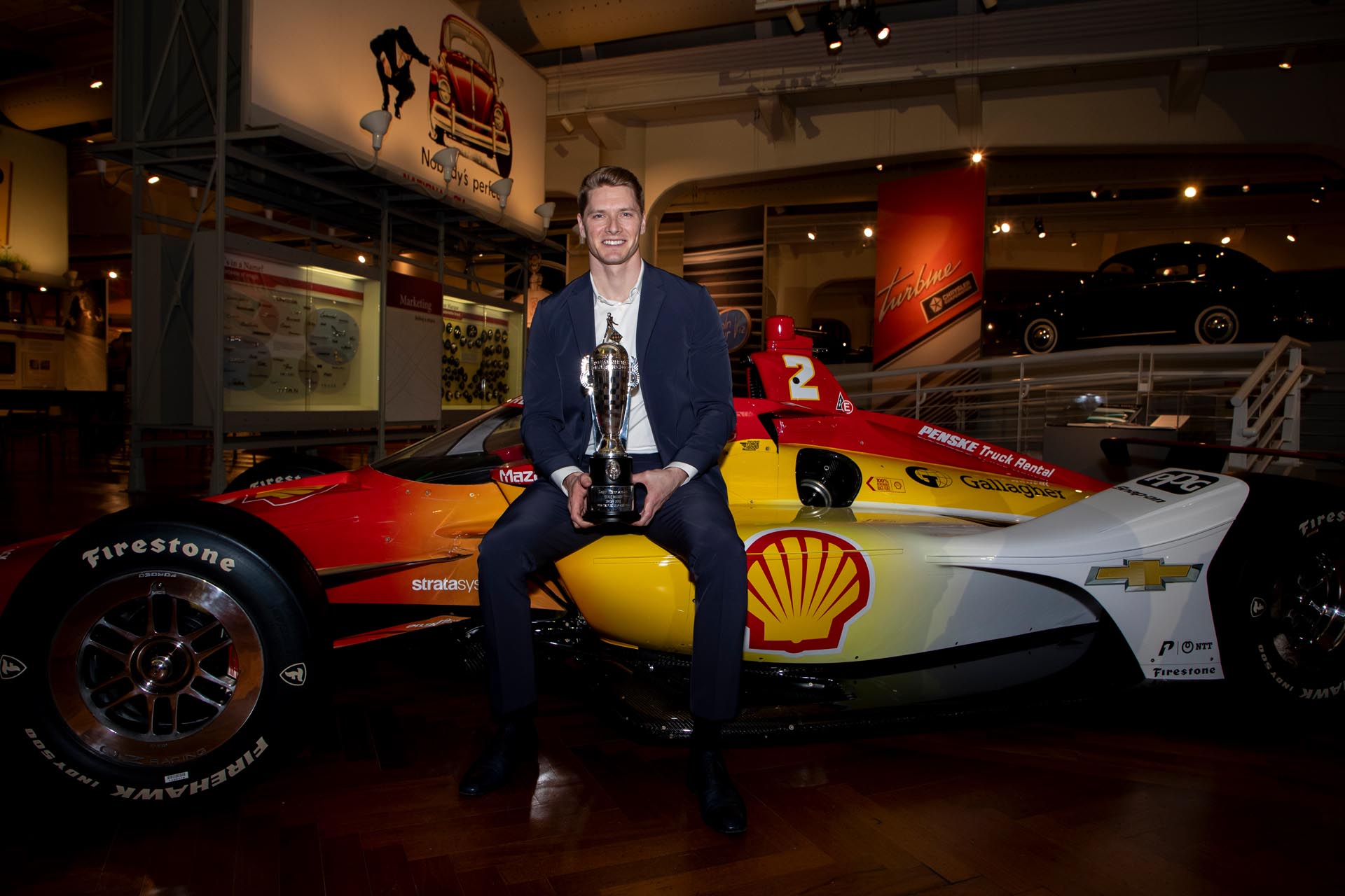 Josef Newgarden sitting on a race car