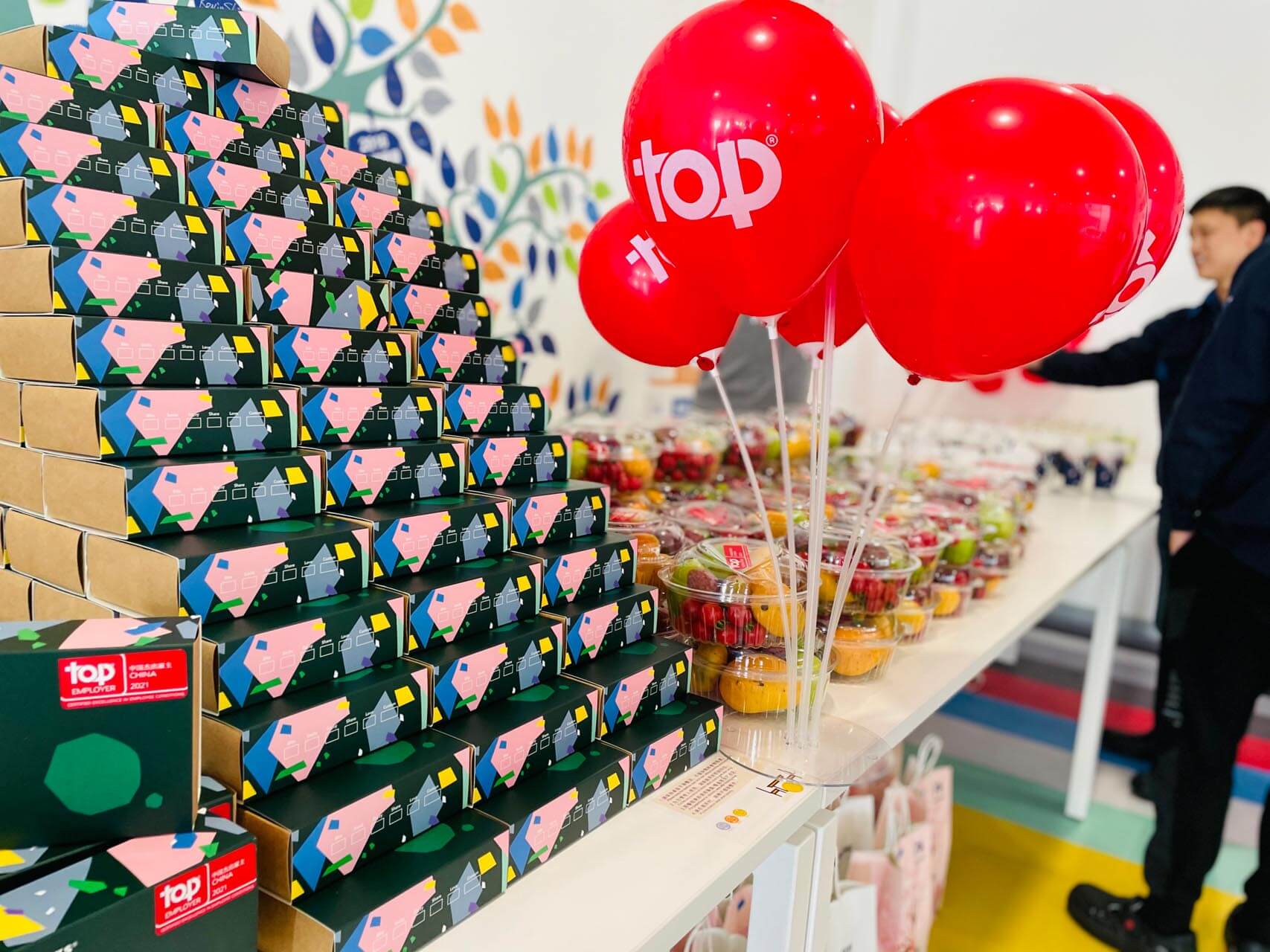 a group of balloons and a stack of boxes