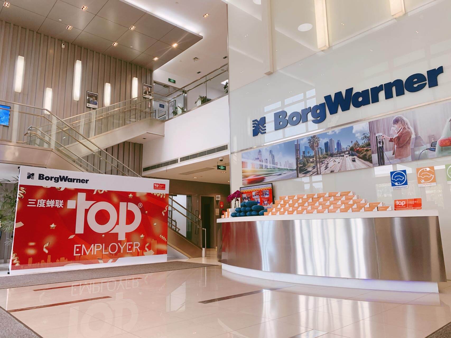 a lobby with a reception desk and signs